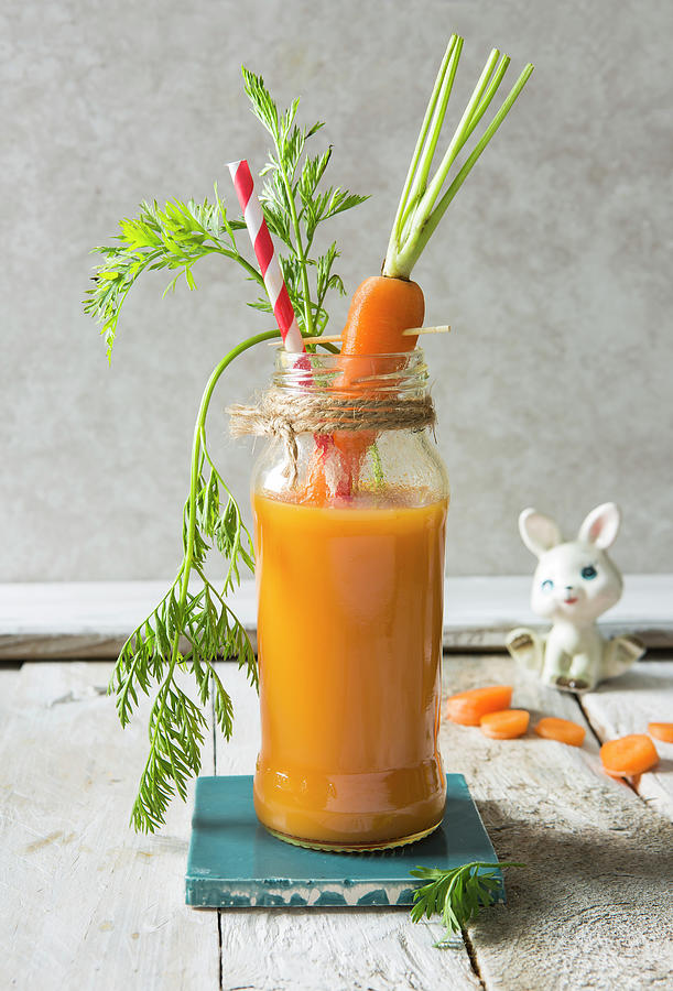 Fresh Carrot Juice Smmothy Drink In A Jar With Bunny Prop Photograph by Stacy Grant