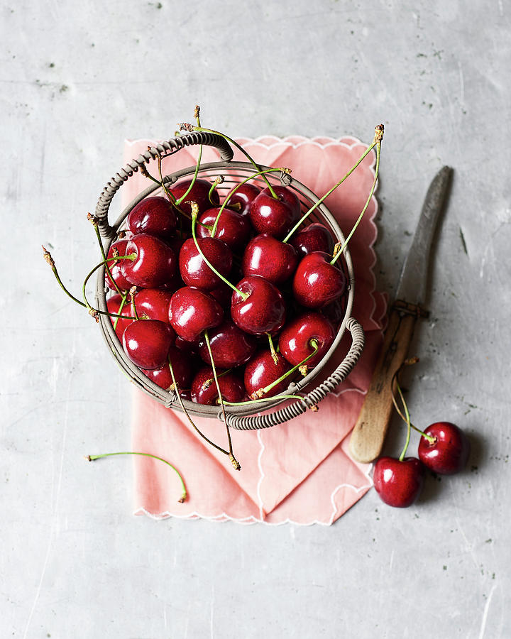 Fresh Cherries In A Basket Photograph by Miha Lorencak