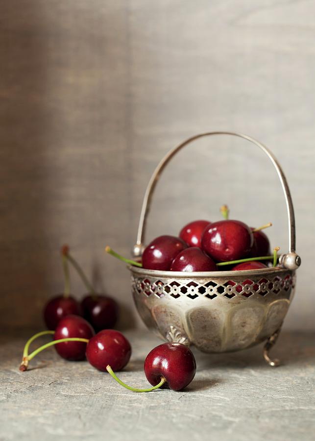 Fresh Cherries In A Silver Bowl Photograph by Jane Saunders