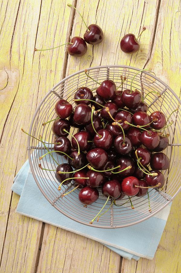 Fresh Cherries In A Wire Basket Photograph by Jean-christophe Riou