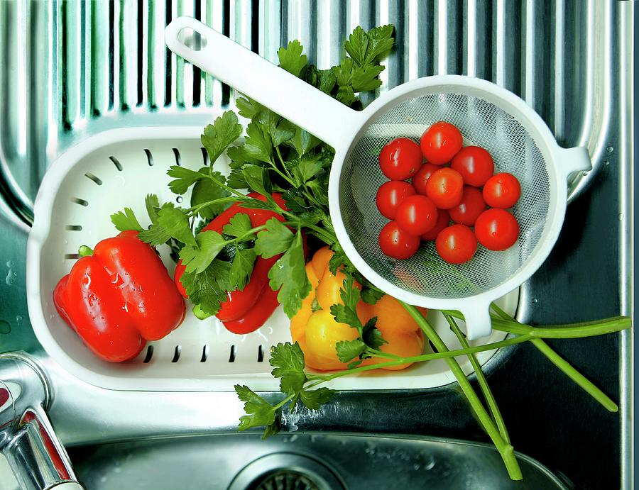 Fresh Cherry Tomatoes, Peppers And Parsley On A Drainer Photograph by Bodo A. Schieren