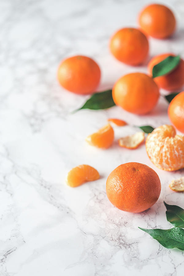 Fresh Clementines On A Marble Surface Photograph by Malgorzata Laniak