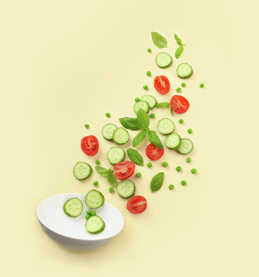 Fresh Cut Salad Ingredients Falling Into White Bowl Photograph by Olena Yeromenko