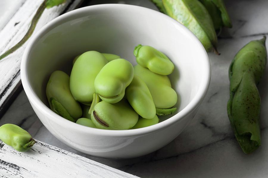 Fresh Fava Beans In A White Bowl Photograph by Katharine Pollak