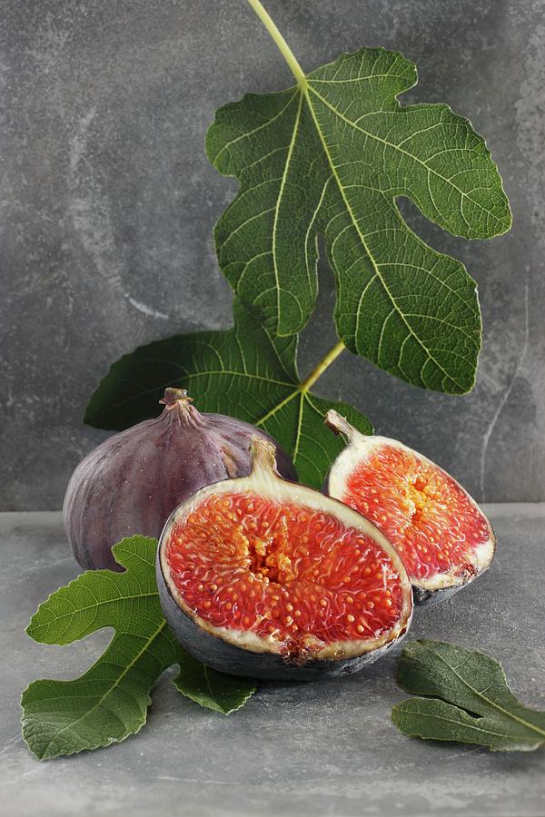 Fresh Figs And Fig Leaves Photograph by Petr Gross