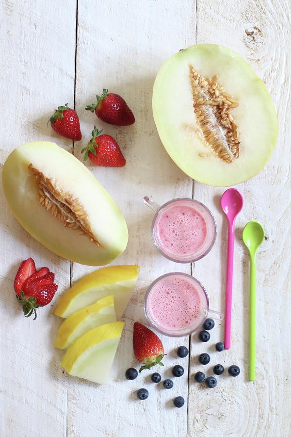 Fresh Fruit And Fruit Yoghurt With Spoons On A Wooden Surface Photograph by Sylvia E.k Photography