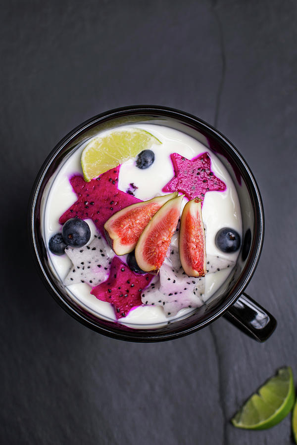 Fresh Fruit With Yogurt On A Dark Surface Photograph by Natalia Mantur