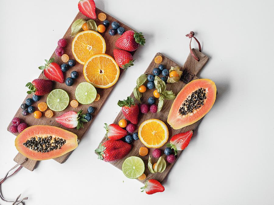 Fresh Fruits Arranged On Two Wooden Boards seen From Above Photograph by Freiknuspern