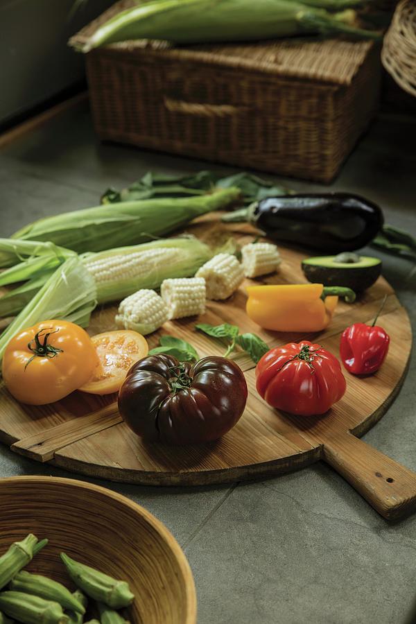Fresh Garden Vegetables And Corn Cob On A Wooden Platter Photograph by Cindy Haigwood