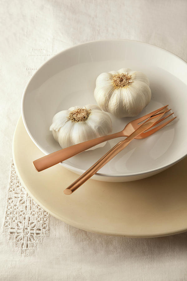 Fresh Garlic And Cutlery In Bowl Photograph by Great Stock!
