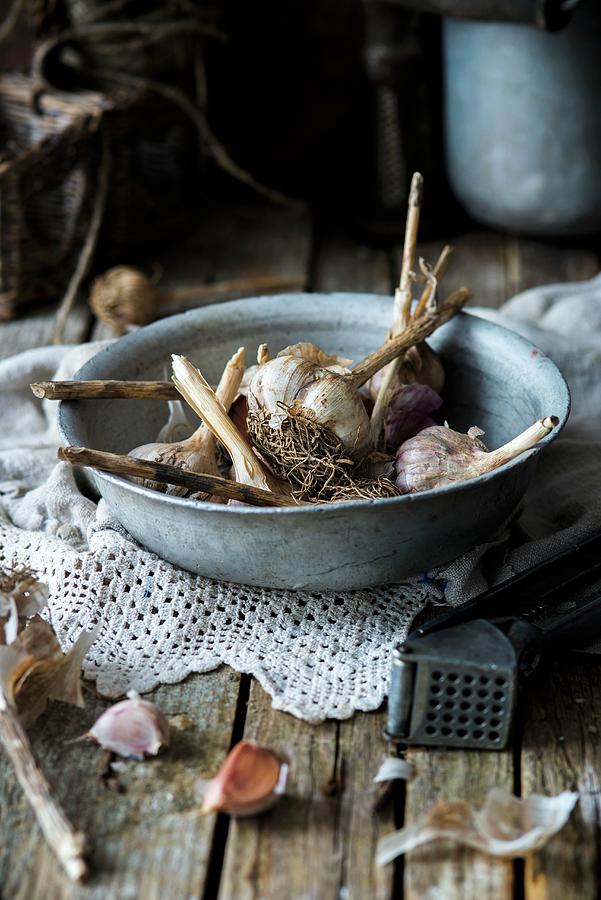 Fresh Garlic In A Bowl Photograph by Irina Meliukh