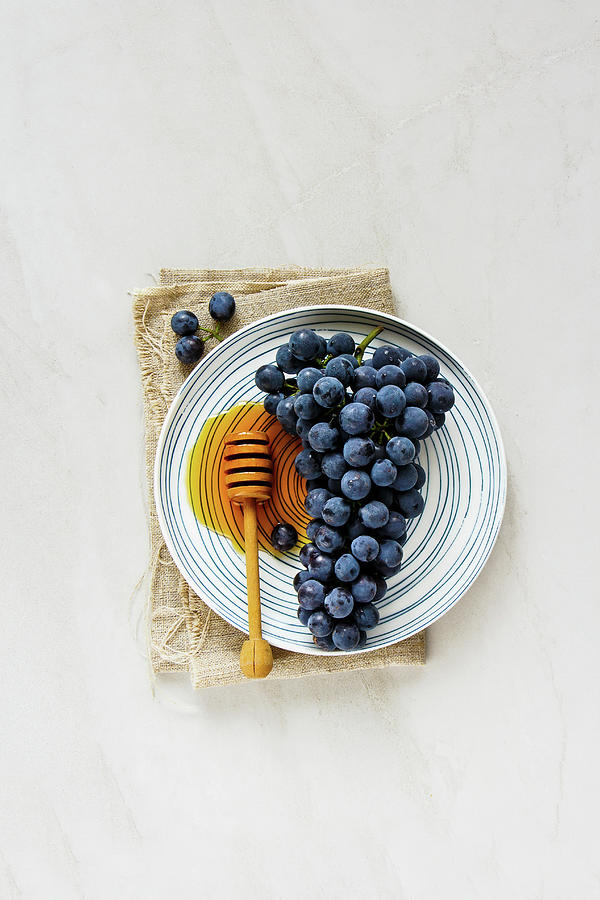 Fresh Grape And Honey On Light Background Photograph by Yuliya Gontar