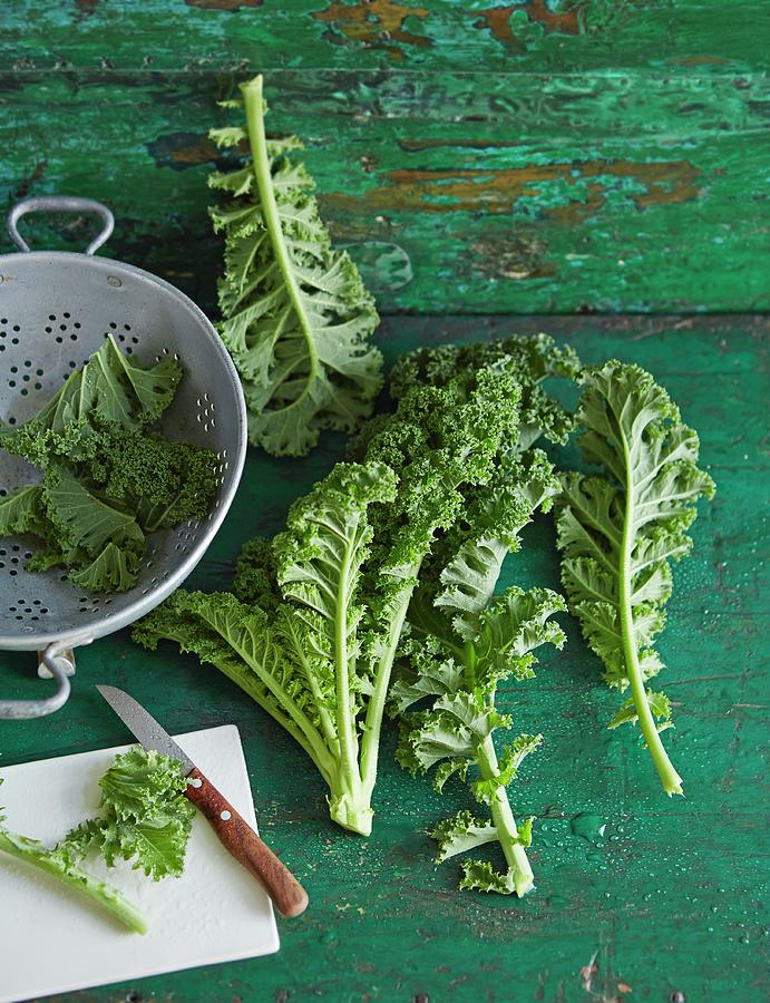 Fresh Green Kale With A Colander And A Knife Photograph by Jalag / Julia Hoersch
