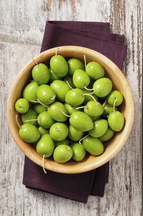 Fresh Green Olives In A Wooden Bowl Photograph by Jean-christophe Riou