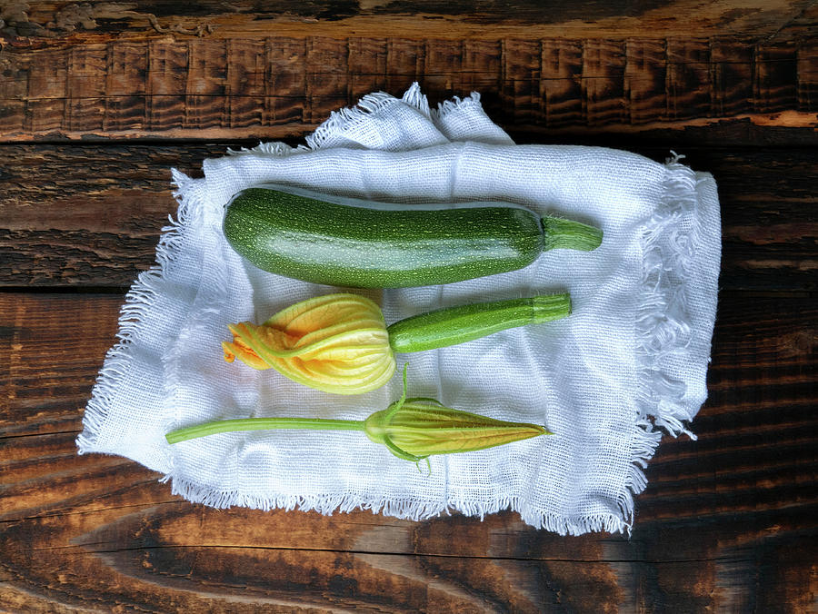 Fresh Green Zucchini And Zucchini Flowers On A Linen Cloth Photograph by Magdalena & Krzysztof Duklas