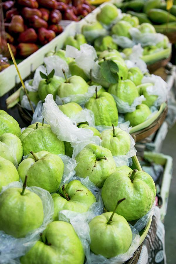 Fresh Guavas Wrapped In Foil At A Market In Thailand Photograph by Maricruz Avalos Flores
