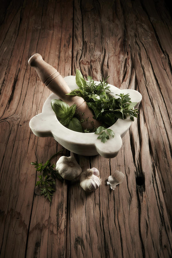 Fresh Herbs With A Pestle In A Marble Mortar Photograph by Shawn Driman Photography