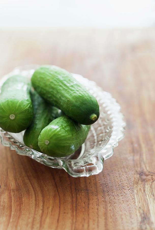 Fresh Mini Cucumbers In A Glass Bowl Photograph by Yelena Strokin
