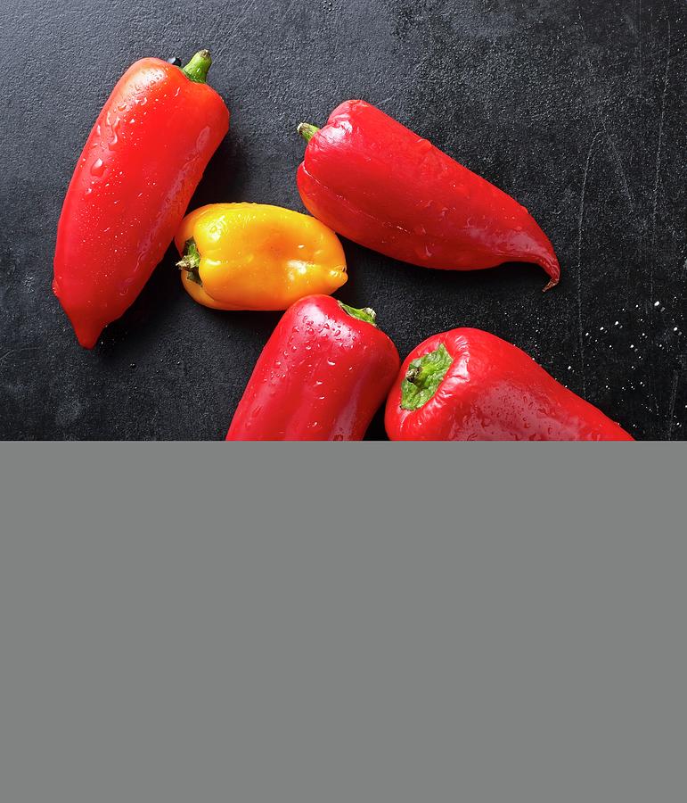 Fresh Mini Peppers On A Black Baking Tray Photograph by Ludger Rose