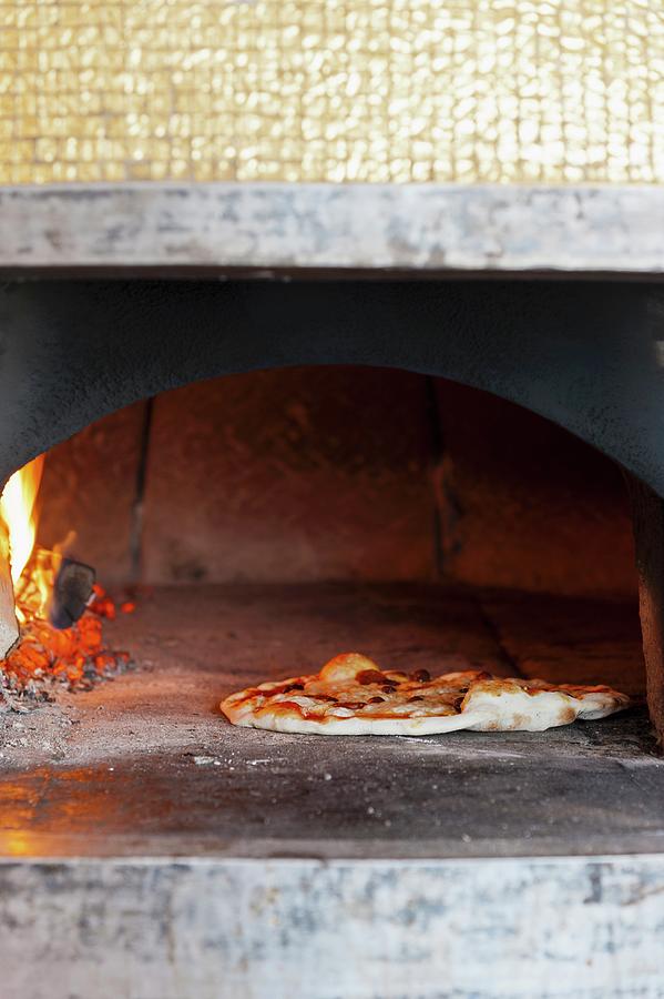 Fresh Mozzarella Pizza In A Wood Burning Oven Photograph by Anthony Lanneretonne