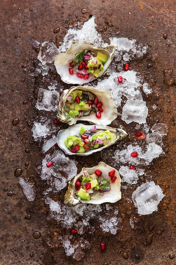 Fresh Oysters With Avocado And Pomegranate Seeds Photograph by Aniko Takacs