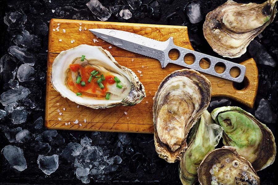 Fresh Oysters With Red Sauce And Chives Photograph by Perry Jackson