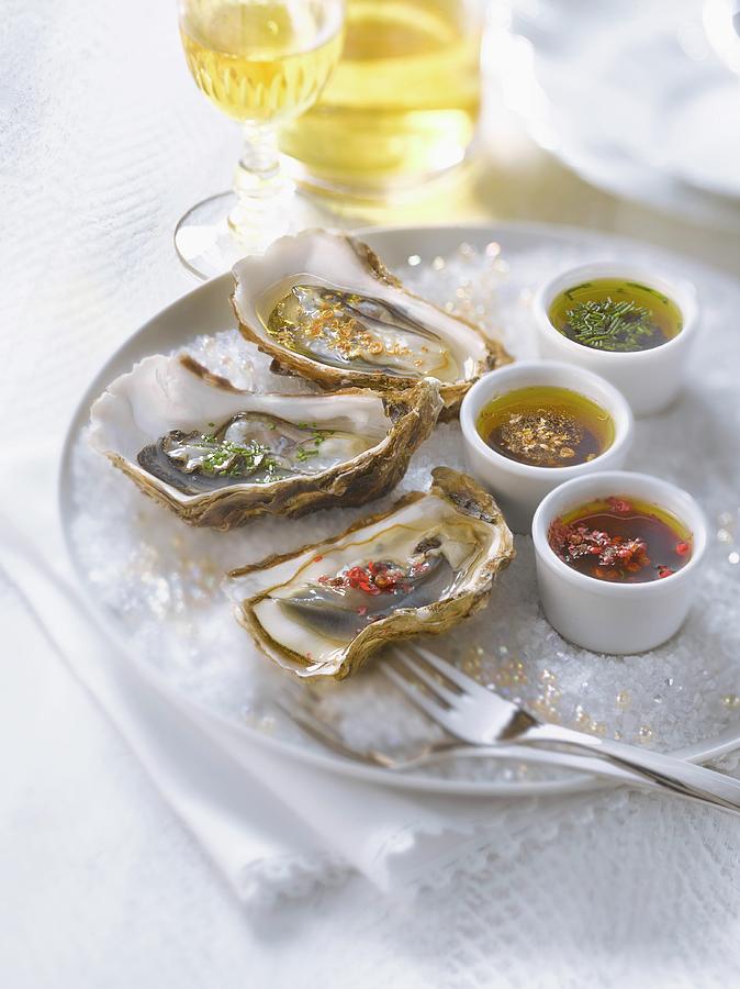 Fresh Oysters With Three Different Flavored Vinaigrettes Photograph by Studio