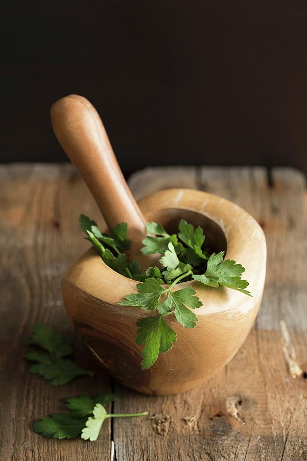 Fresh Parsley In A Wooden Mortar Photograph by Sonia Chatelain