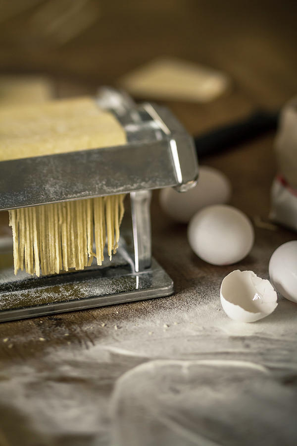 Fresh Pasta Coming Out Of Pasta Photograph by Westend61