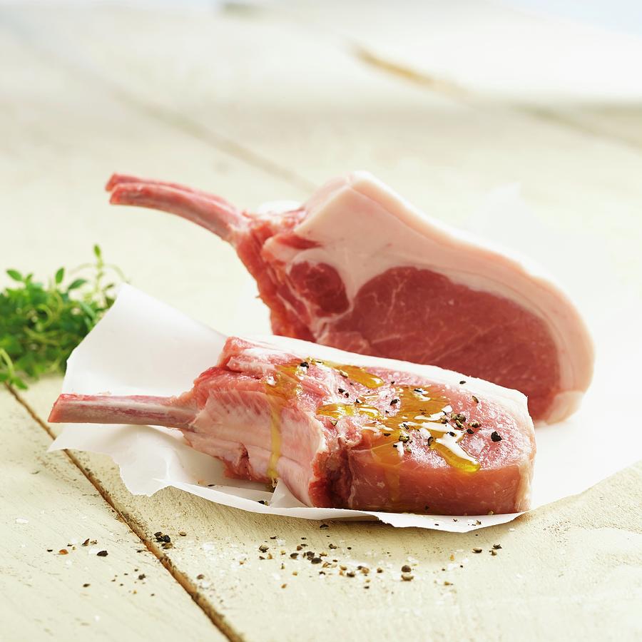 Meat Photograph - Fresh Pork Chops With Olive Oil And Pepper by Studio R. Schmitz