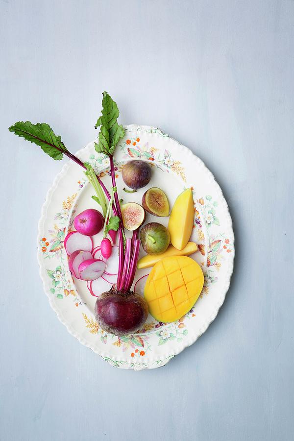 Fresh Radishes, Beetroot, Mango And Figs On A Plate seen From Above Photograph by Great Stock!