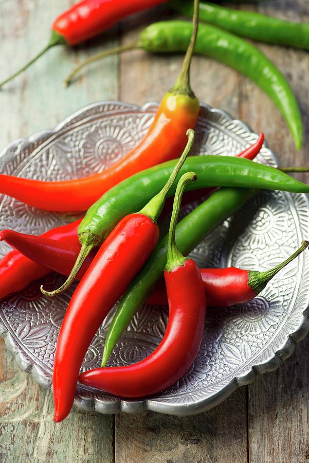 Fresh Red And Green Chilli Peppers Photograph by Jonathan Short