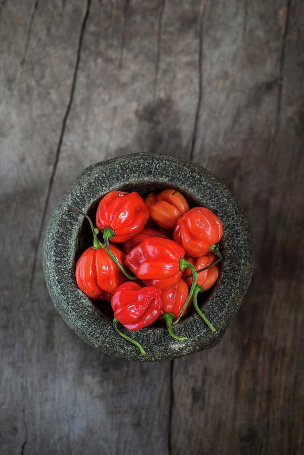 Fresh Scotch Bonnet Chilli Peppers In A Mortar Photograph by Nitin Kapoor