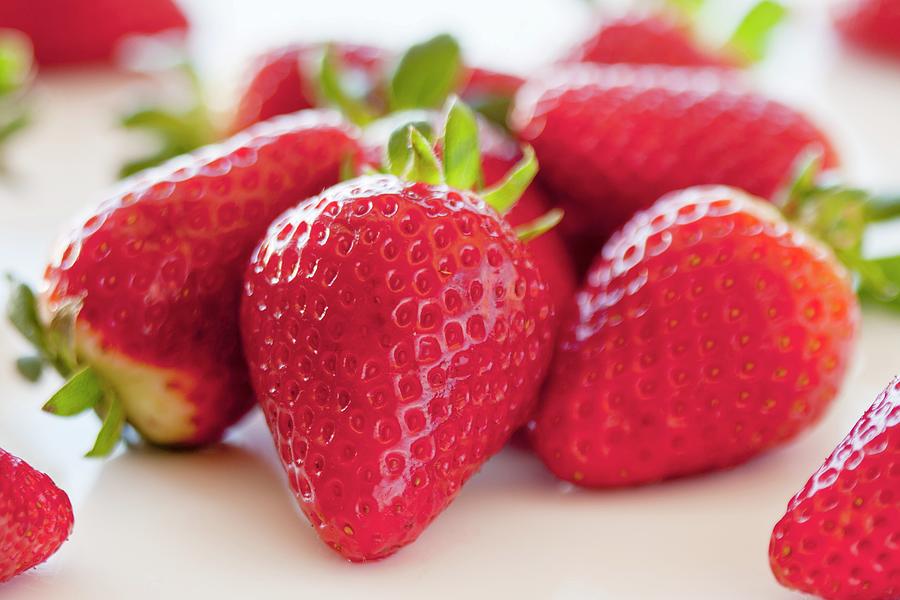 Fresh Strawberries Close Up; One With Stem Photograph by Creative Photo Services