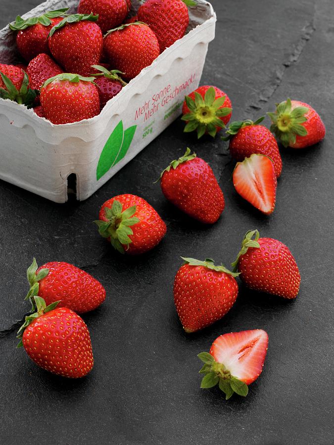 Fresh Strawberries In A Cardboard Punnet And Next To It Photograph by Albert Fritz