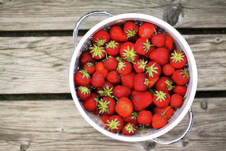Fresh Strawberries In A Colander seen From Above Photograph by Sandra Krimshandl-tauscher
