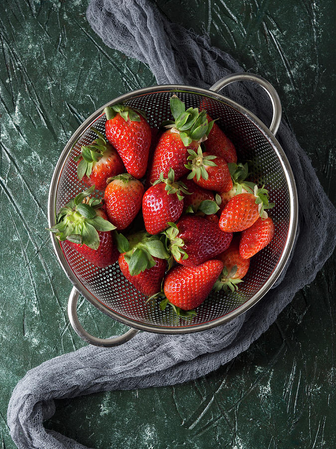 Fresh Strawberries In A Metal Colander Over Green Background Photograph by Sofya Bolotina