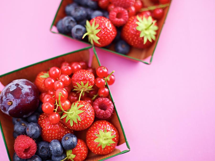 Fresh Summer Berries And Fruits In Small Dishes Photograph by Oliver Brachat