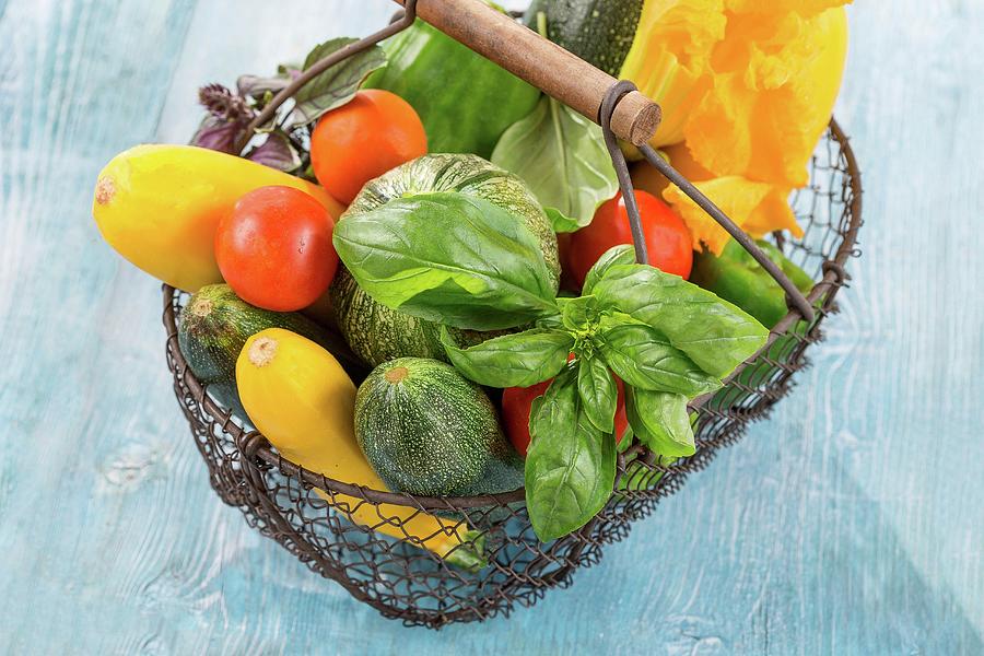 Fresh Summer Vegetables And Basil In A Wire Basket Photograph by Jean-paul Chassenet