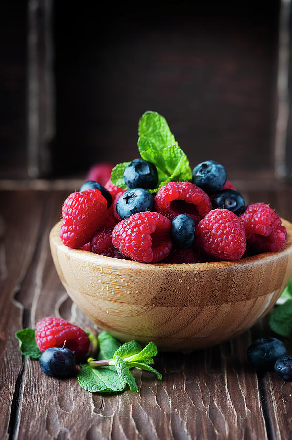 Fresh Sweet Raspberry And Bluberry Photograph by Oxana Denezhkina