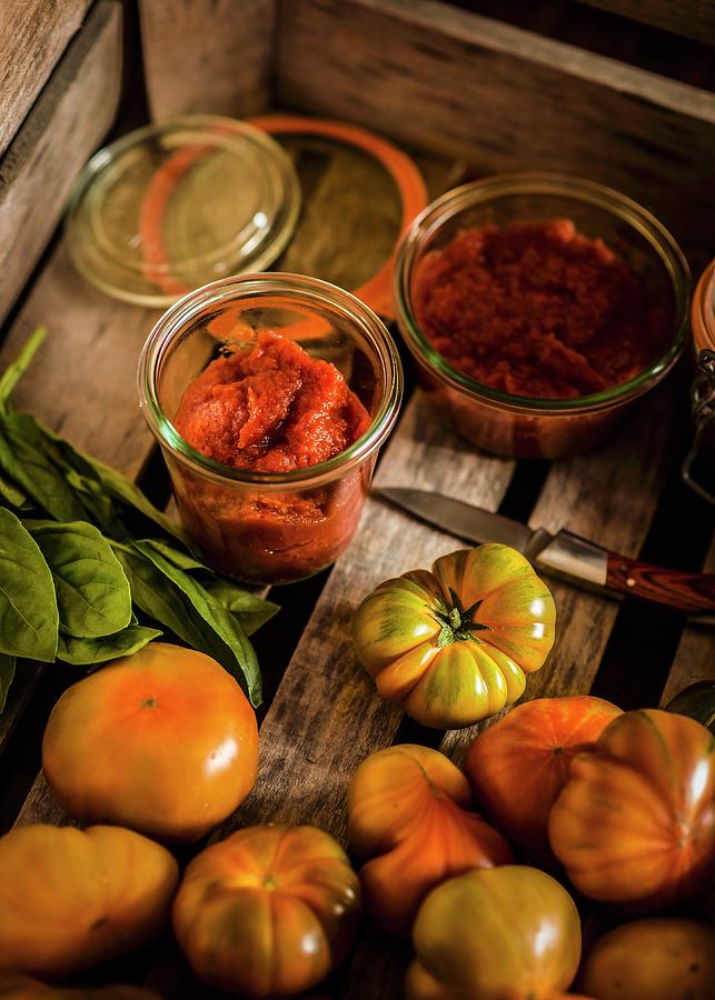 Fresh Tomatoes And Jars Of Homemade Tomato Pure Photograph by Miriam Garcia