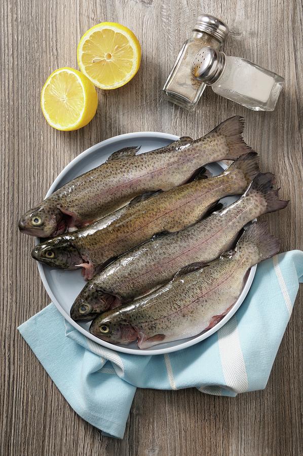 Fresh Trout, Lemon, Salt And Pepper Photograph By Jean-christophe Riou 