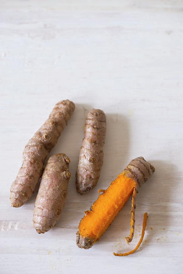 Fresh Turmeric Roots, Peeled And Unpeeled Photograph by Laurange