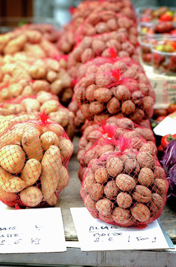 Potato Photograph - Fresh Walnuts And Potatoes On A Market Stand by Jamie Watson