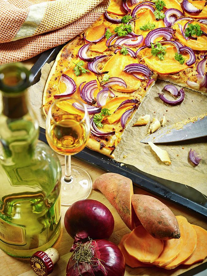 Freshly Baked And Sliced Tarte Flambe With Sweet Potatoes, Red Onions, Calvados And Parsley On A Baking Tray Photograph by Foto4food