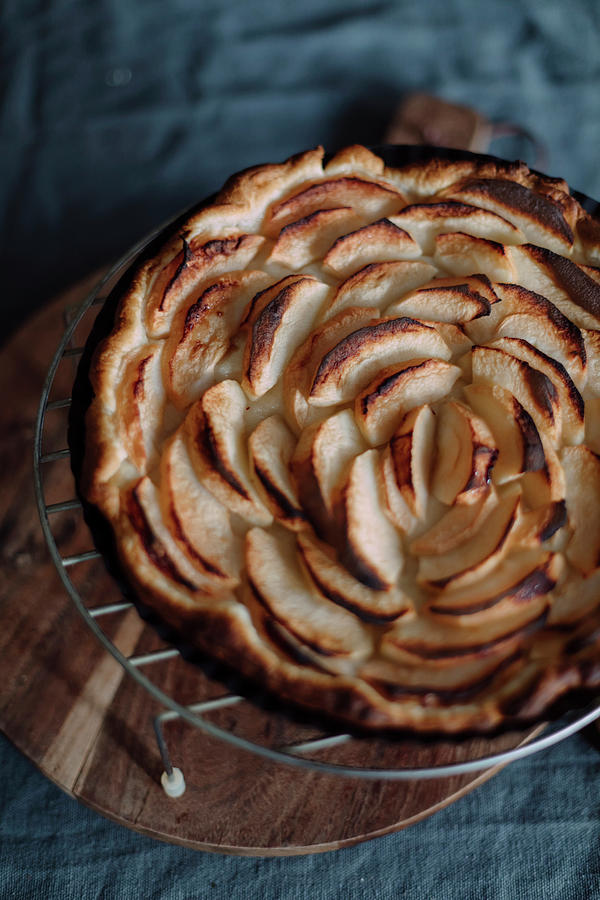 Freshly Baked Apple Tart On A Wire Rack Photograph by Pia Simon