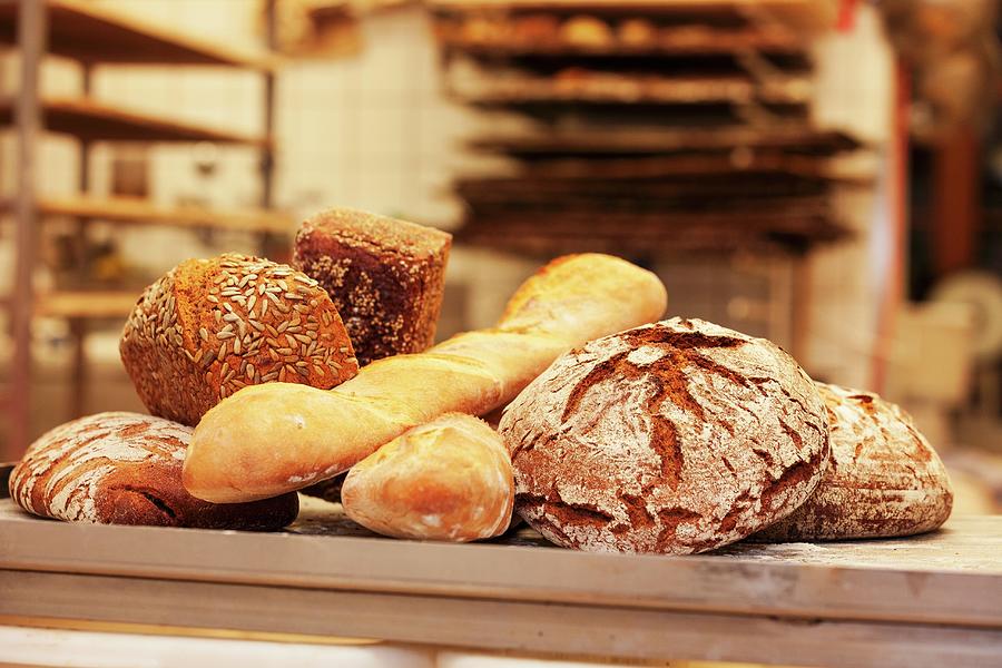 Freshly Baked Bread In A Bakery Photograph by Anneliese Kompatscher