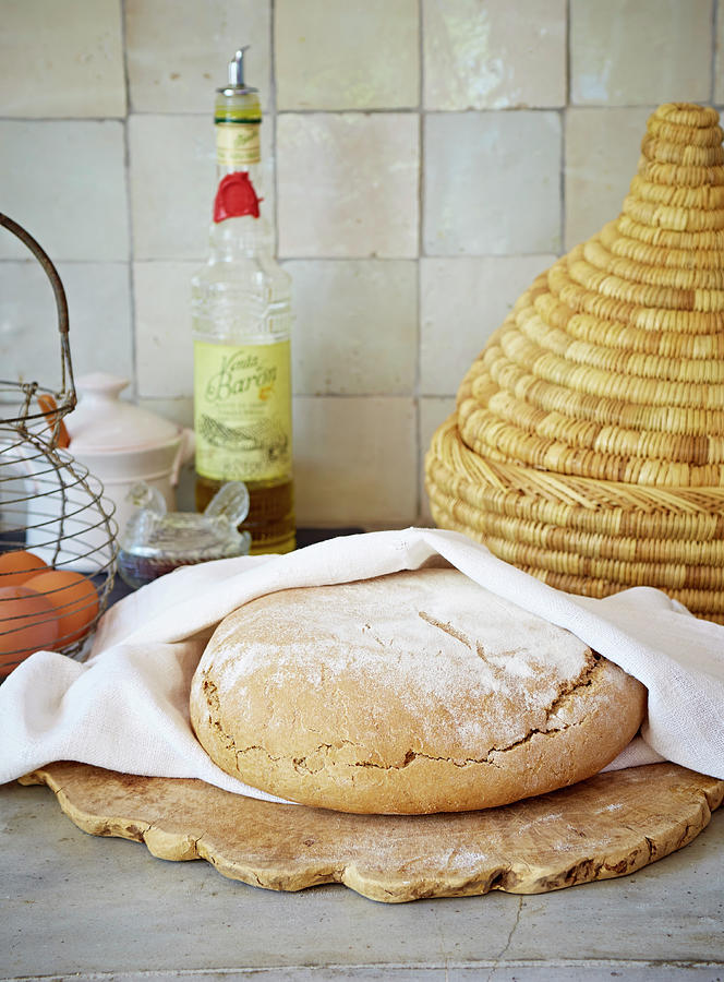 Freshly Baked Bread In A Linen Cloth Photograph by Sven C. Raben