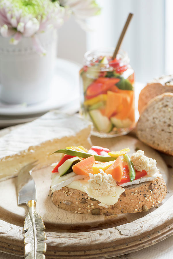 Freshly Baked Bread With Cheese And Pickled Vegetables Photograph by Winfried Heinze
