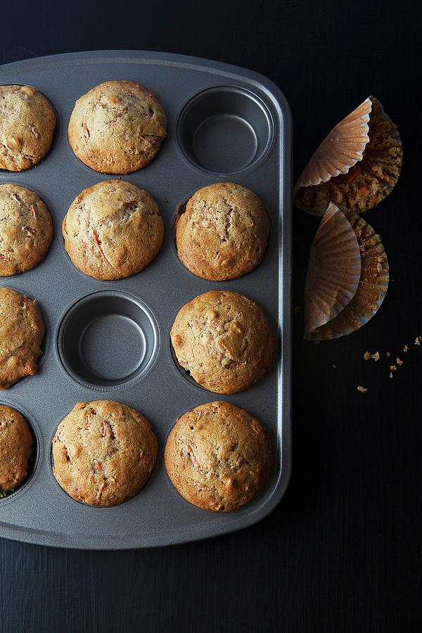 Freshly Baked Carrot Muffins In A Muffin Tin Photograph by Vfoodphotography